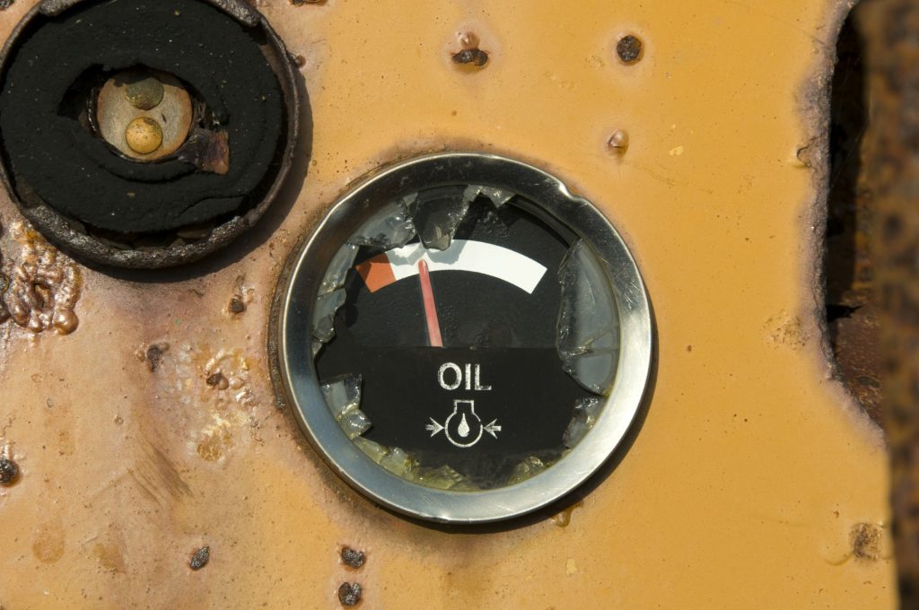 Oil gauge showing nearly empty on a tank